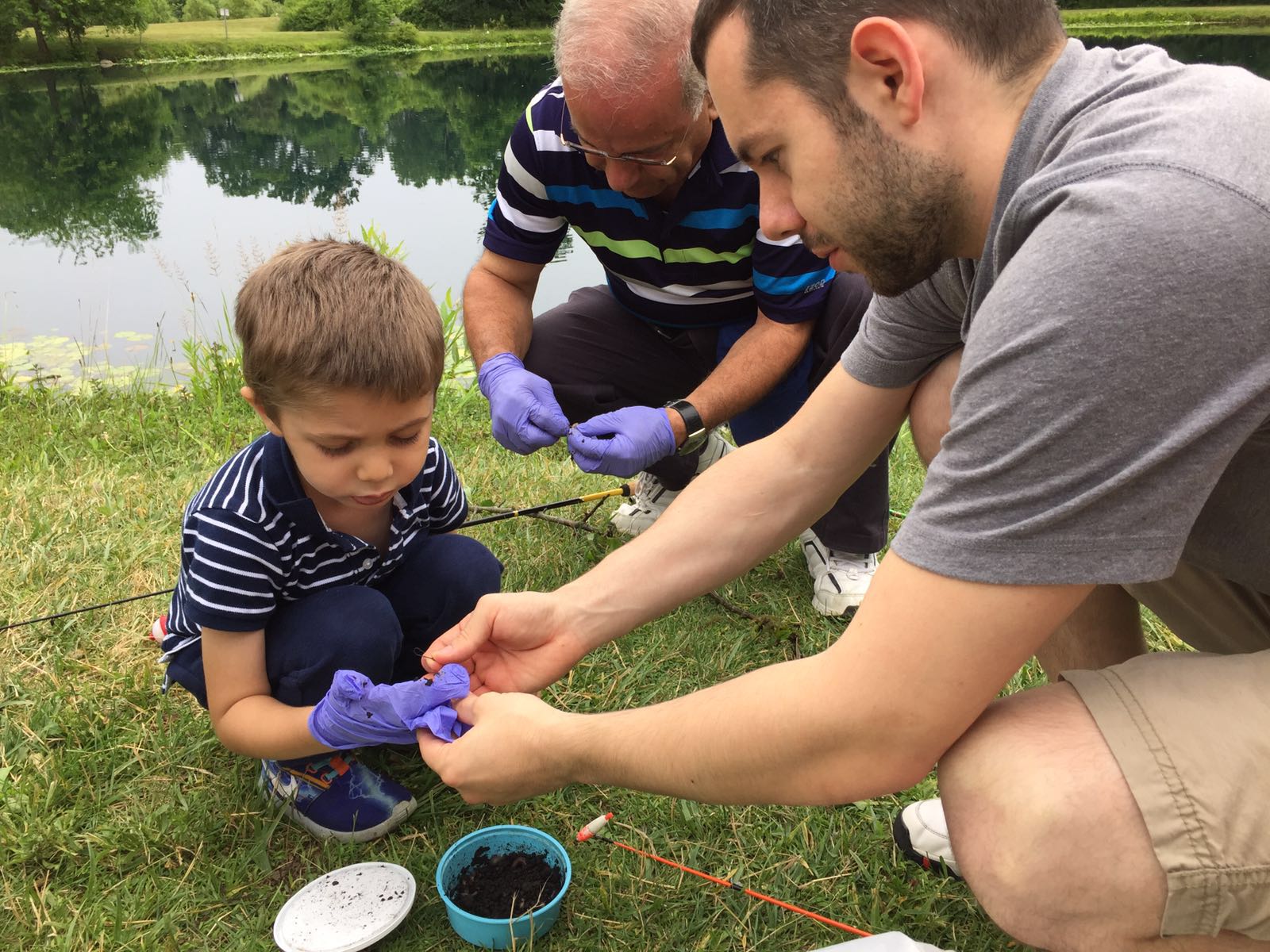 Dr. Korkor fishing with a little boy